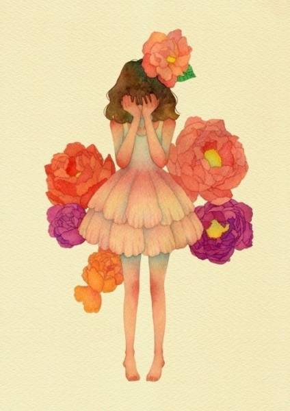 Девушка плачет на фоне цветов